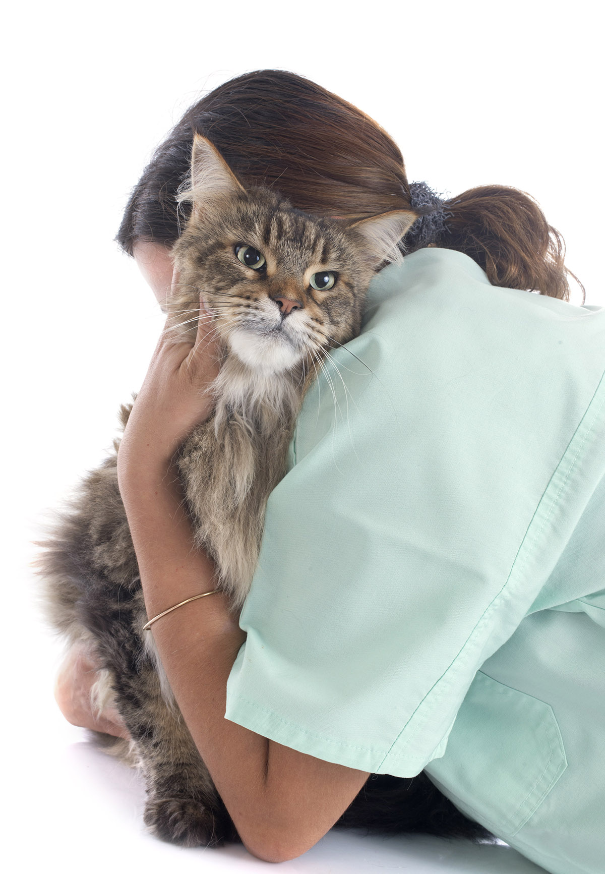 woman hugging a main coon cat